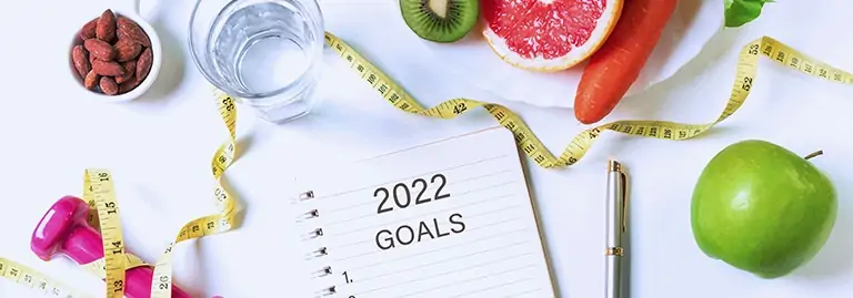 Flat lay photo of tape measure fruits and vegetables, fitness goals in 2022