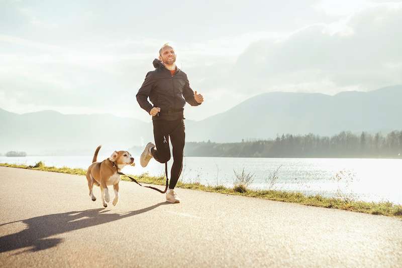 FHL young man on a run with his dog