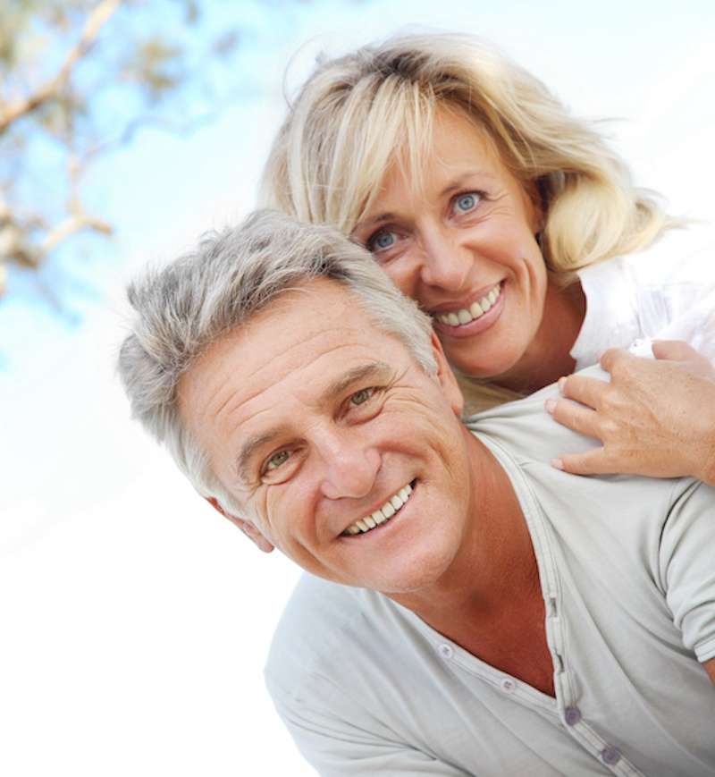 happy older couple embracing