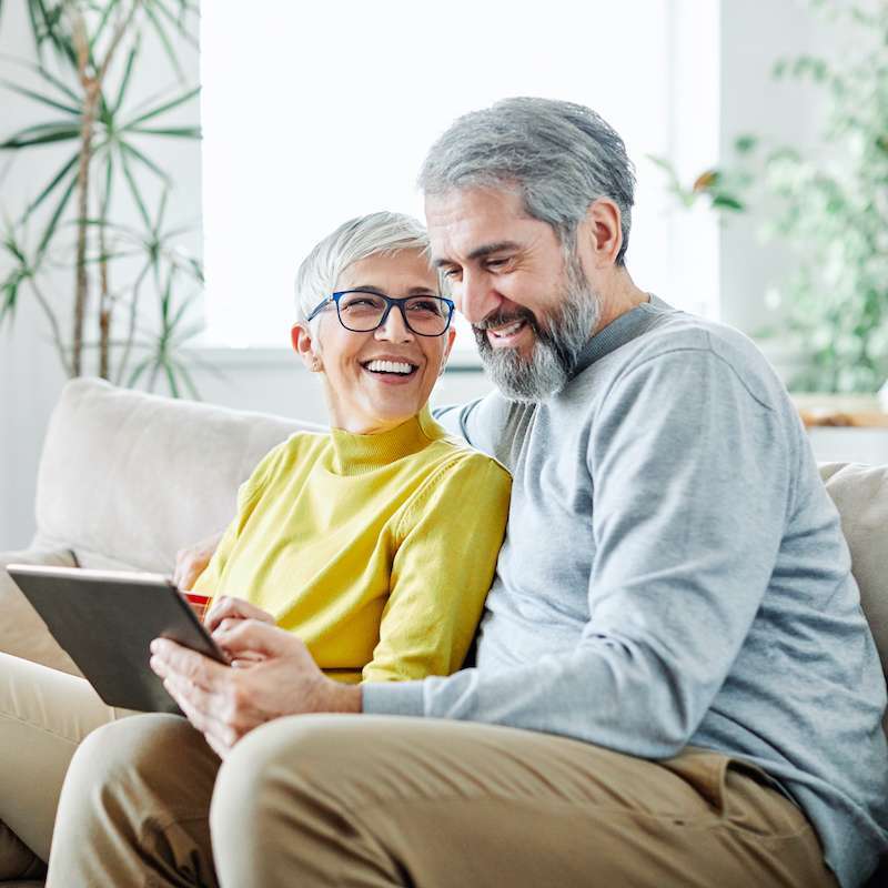 older couple relaxing on the couch