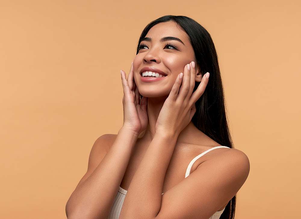 Young Asian woman with clean healthy glowing skin 