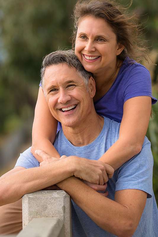 Portrait of an elder couple holding hands