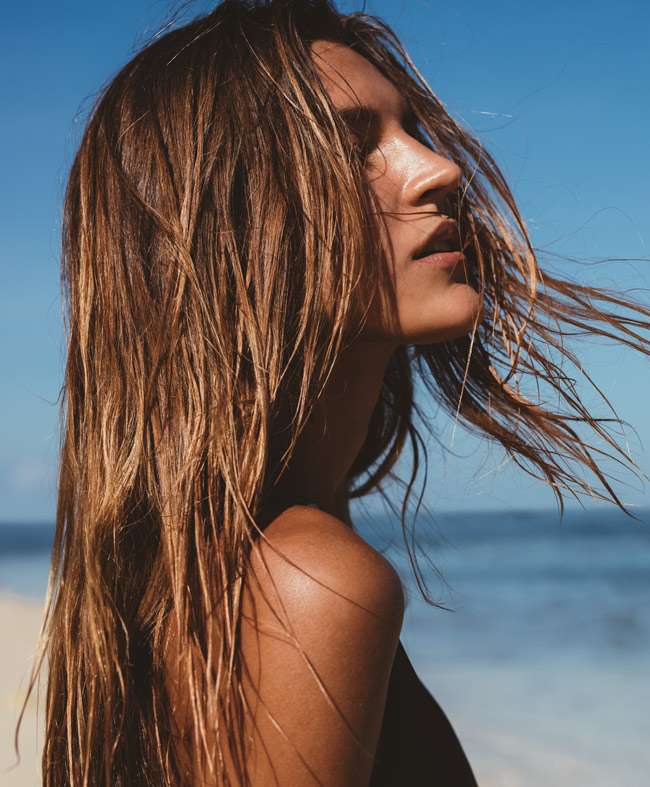 Beautiful young woman on the beach