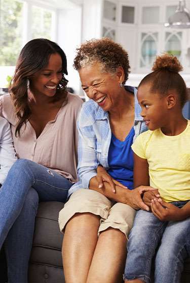 family portrait of husband wife and daughter smiling red alert screening at forward healthy lifestyles