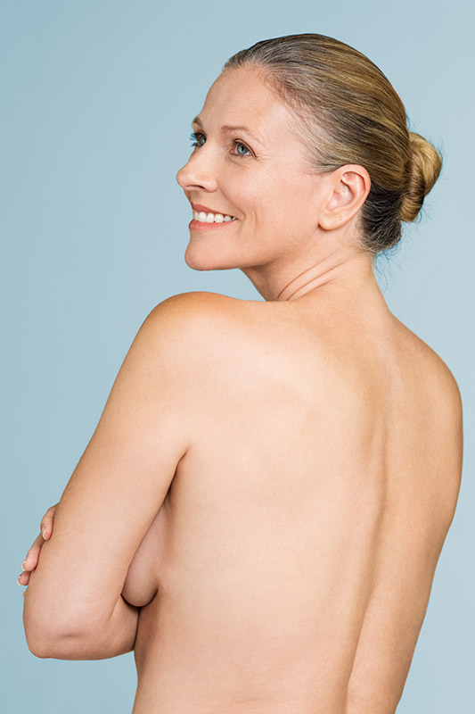 mature naked woman standing