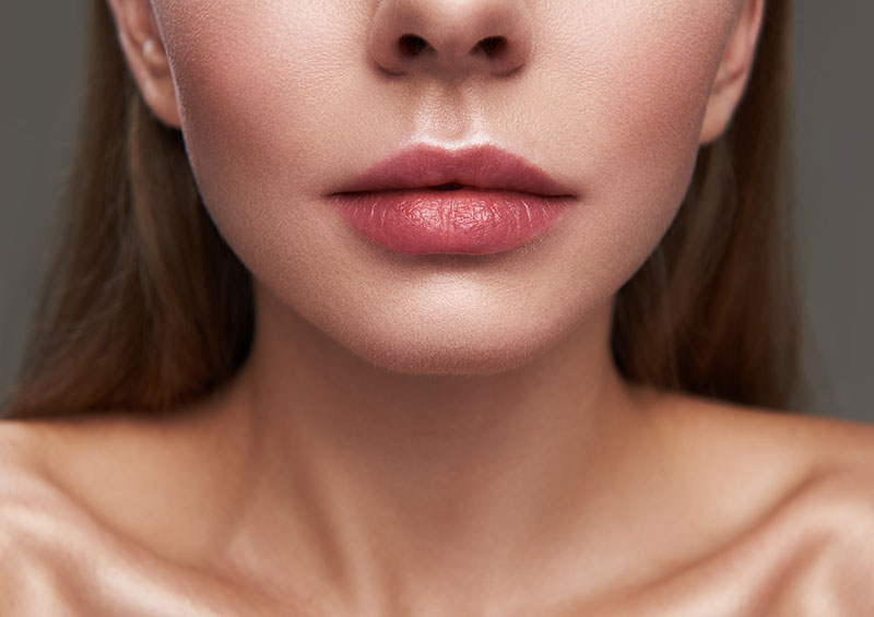 Attractive young woman with beautiful full lips Attractive young woman with beautiful full lips